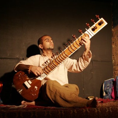 A photo of me playing sitar during The Masrayana